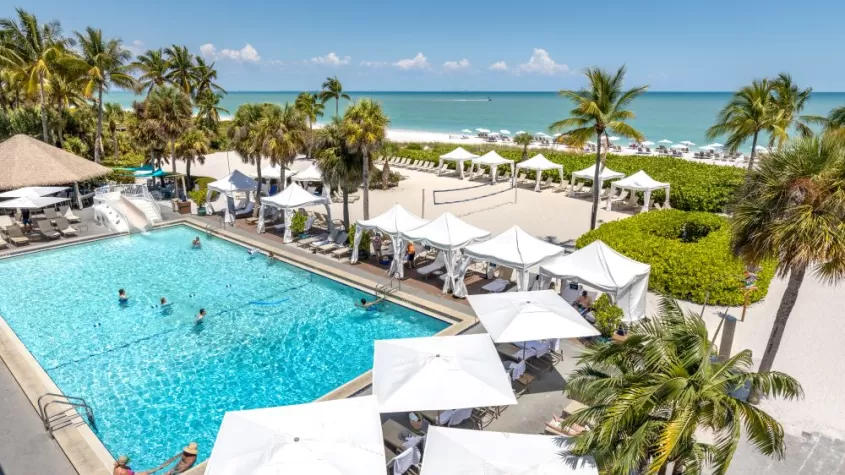 drone view of resort pool and beach in background